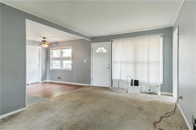 interior space featuring carpet and ceiling fan