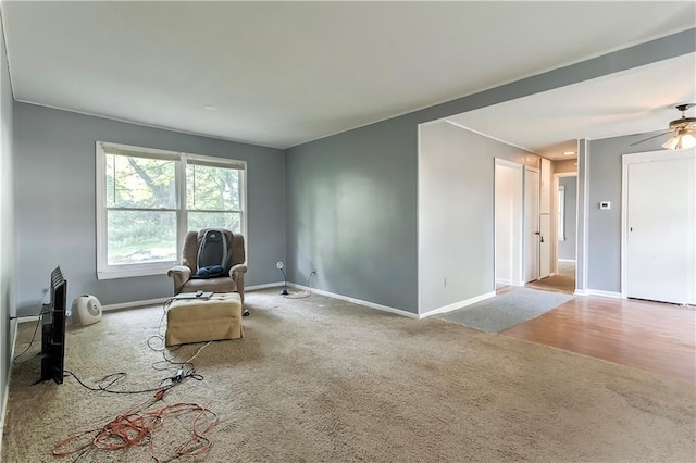 sitting room featuring carpet floors and ceiling fan