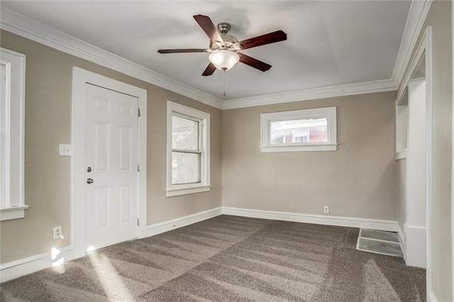 carpeted empty room featuring ornamental molding and ceiling fan