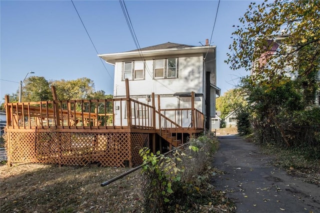 rear view of property with a deck