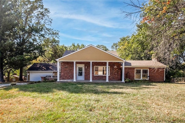 single story home with a front yard and a garage