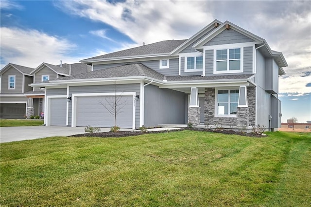 view of front of home featuring a garage and a front lawn