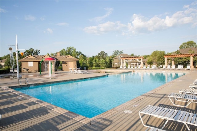 view of swimming pool with a patio area and a pergola