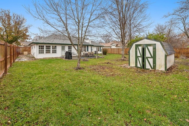 view of yard featuring a patio area and a storage unit