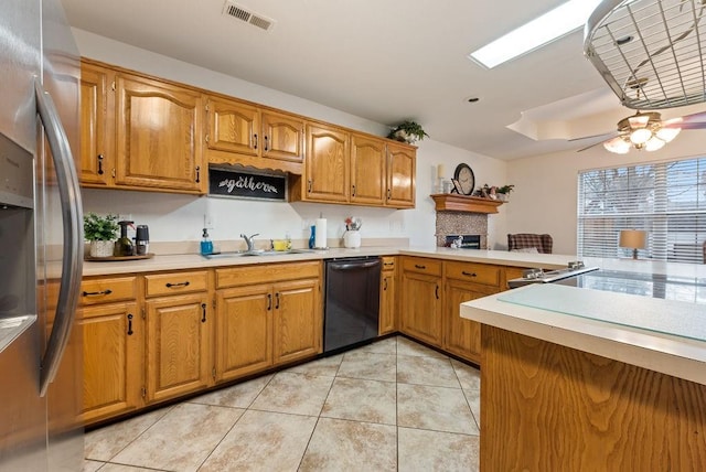 kitchen with stainless steel refrigerator, ceiling fan, dishwasher, sink, and kitchen peninsula