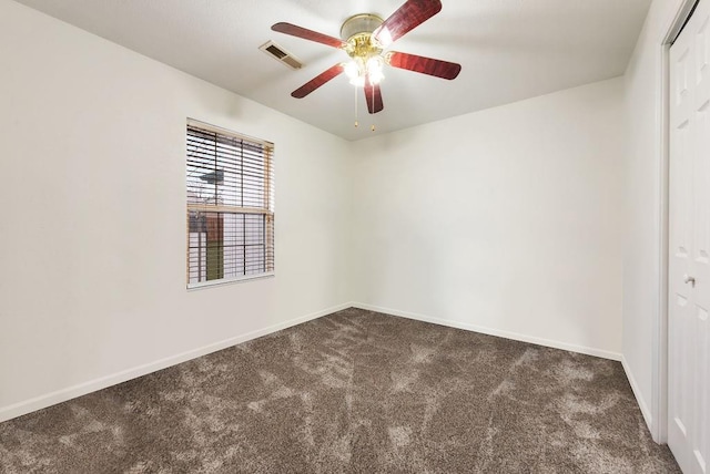 carpeted empty room featuring ceiling fan