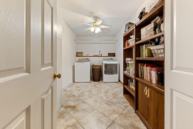 laundry area featuring light tile patterned floors, washer and clothes dryer, and ceiling fan