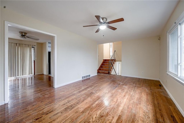 spare room with ceiling fan and hardwood / wood-style floors