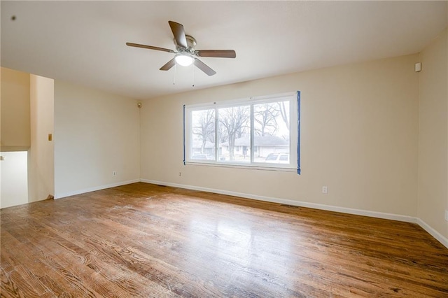 unfurnished room with wood-type flooring and ceiling fan