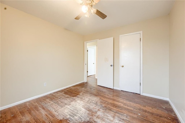 unfurnished bedroom with hardwood / wood-style flooring and ceiling fan