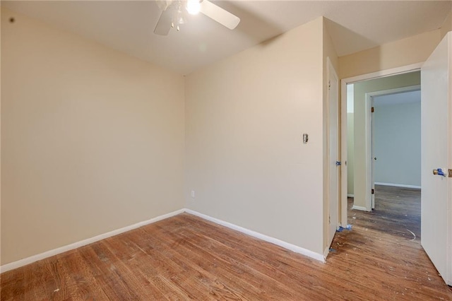 spare room featuring hardwood / wood-style flooring and ceiling fan