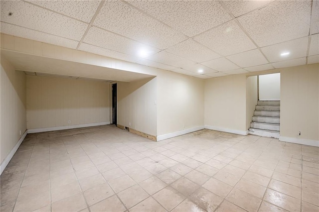 basement featuring a drop ceiling