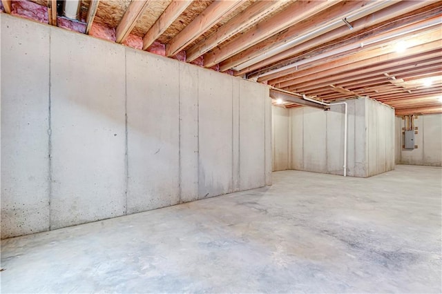 unfinished below grade area with electric panel