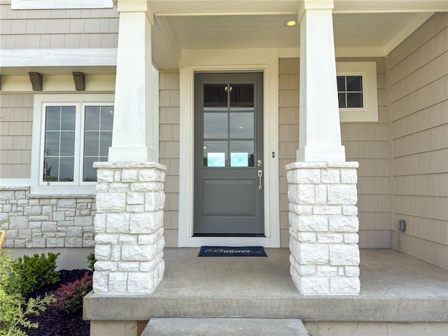 22070 W 100th Ter, Lenexa, KS 66220 - doorway to property with a porch and stone siding