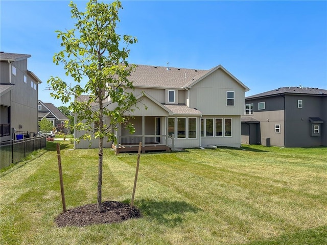 22070 W 100th Ter, Lenexa, KS 66220 - rear view of house with roof with shingles and a sunroom