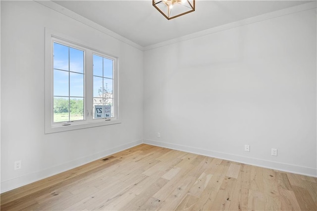 22070 W 100th Ter, Lenexa, KS 66220 - spare room with ornamental molding and light wood-type flooring