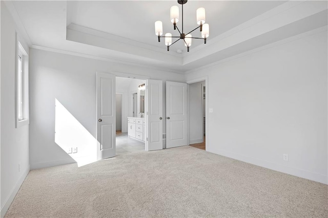 22070 W 100th Ter, Lenexa, KS 66220 - carpeted empty room with a chandelier, crown molding, and a tray ceiling