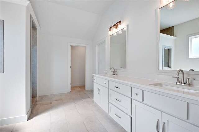 22070 W 100th Ter, Lenexa, KS 66220 - bathroom with double vanity and vaulted ceiling