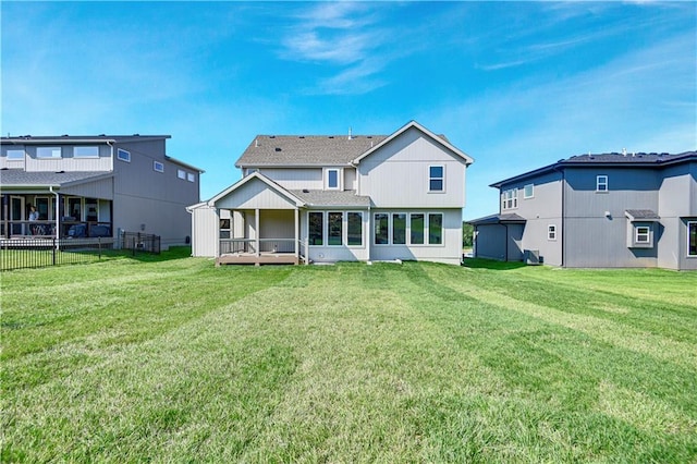 22070 W 100th Ter, Lenexa, KS 66220 - rear view of property with a sunroom and a shingled roof