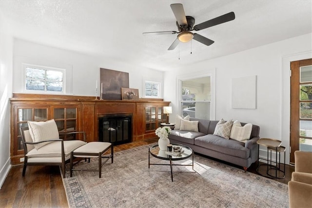 living room with hardwood / wood-style floors, a healthy amount of sunlight, and ceiling fan