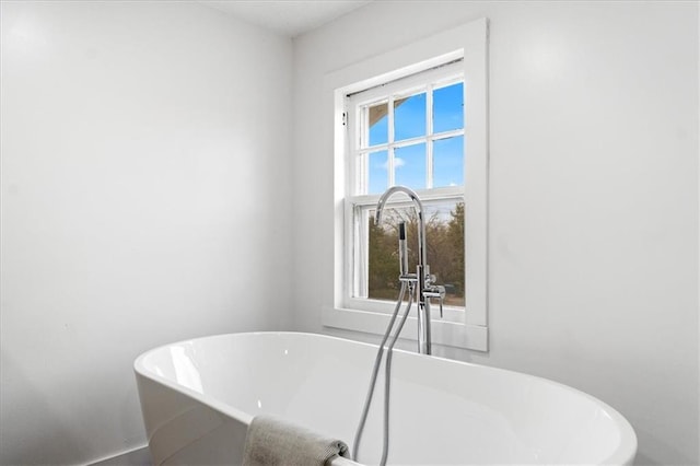 bathroom with sink and a bathing tub