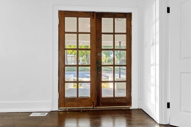 doorway featuring french doors and dark wood-type flooring