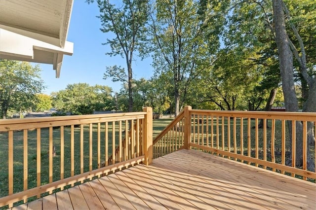 wooden deck with a yard