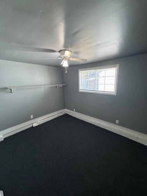 empty room with ceiling fan and carpet flooring