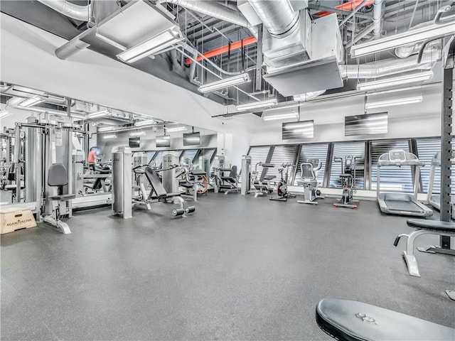 workout area featuring a high ceiling