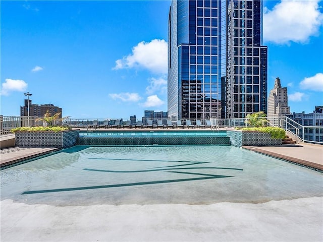 view of swimming pool with a patio