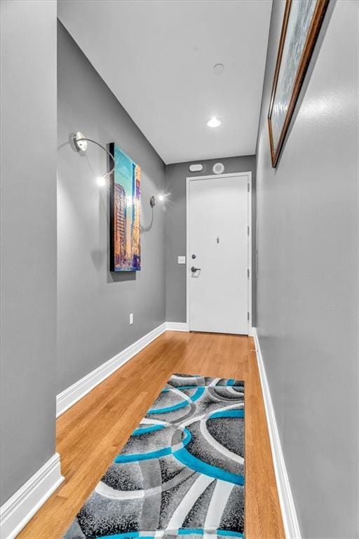 doorway with hardwood / wood-style floors