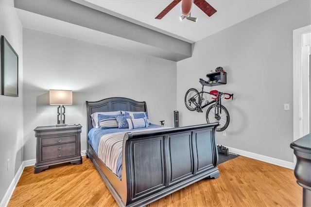 bedroom with light wood-type flooring and ceiling fan