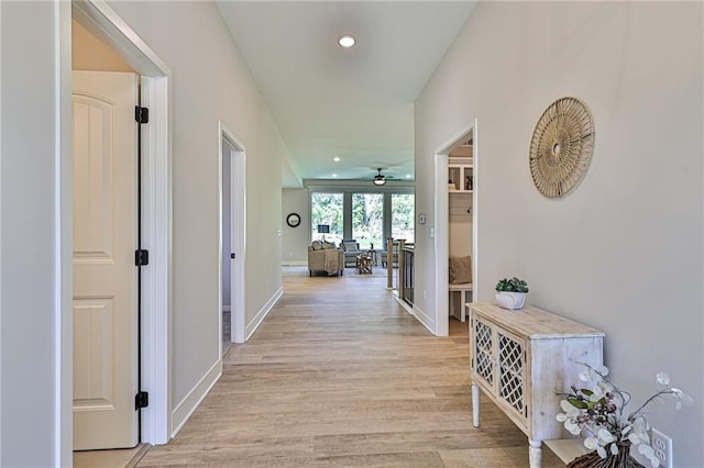 hall with light hardwood / wood-style floors