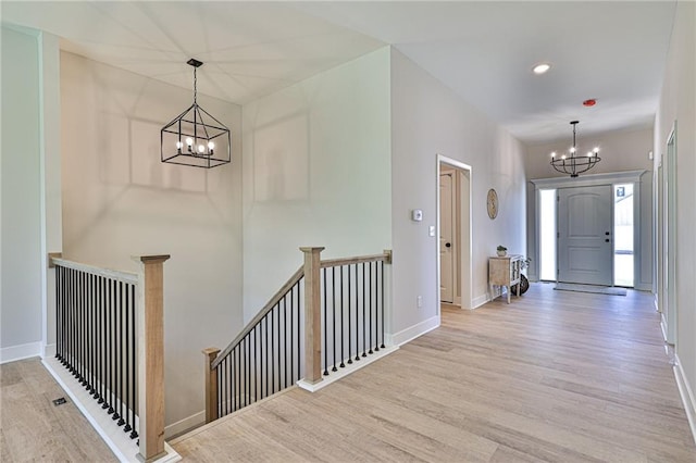 entryway featuring a notable chandelier and light hardwood / wood-style flooring