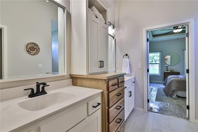 bathroom featuring tile patterned floors, vanity, and ceiling fan