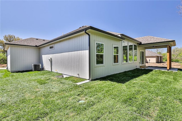 view of property exterior featuring a yard and central AC unit