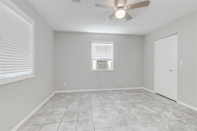 empty room with ceiling fan and cooling unit