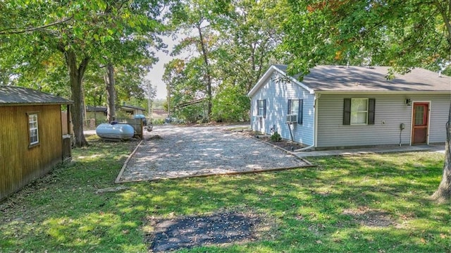 view of yard featuring cooling unit and a patio