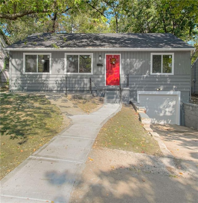 ranch-style house featuring a garage