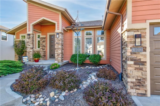 4500 SW Aft Dr, Lees Summit, MO 64082 - entrance to property with an attached garage and stone siding