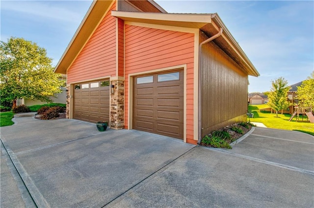 4500 SW Aft Dr, Lees Summit, MO 64082 - view of property exterior with a garage and concrete driveway