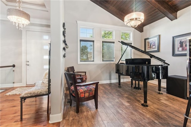 living area with vaulted ceiling with beams, wood ceiling, hardwood / wood-style flooring, and a chandelier