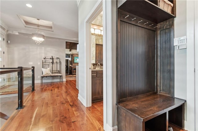 4500 SW Aft Dr, Lees Summit, MO 64082 - mudroom with recessed lighting, light wood finished floors, a tray ceiling, baseboards, and a notable chandelier