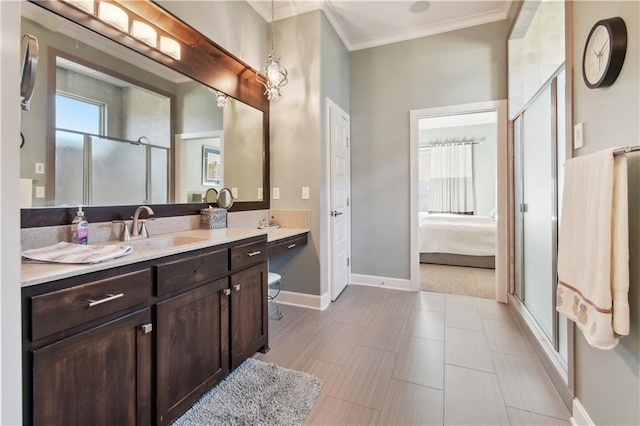 4500 SW Aft Dr, Lees Summit, MO 64082 - ensuite bathroom with a shower stall, crown molding, vanity, baseboards, and ensuite bath