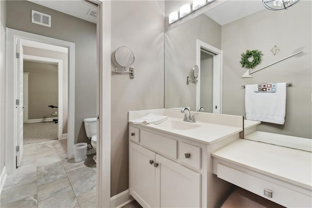 4500 SW Aft Dr, Lees Summit, MO 64082 - bathroom featuring vanity, marble finish floor, baseboards, toilet, and visible vents