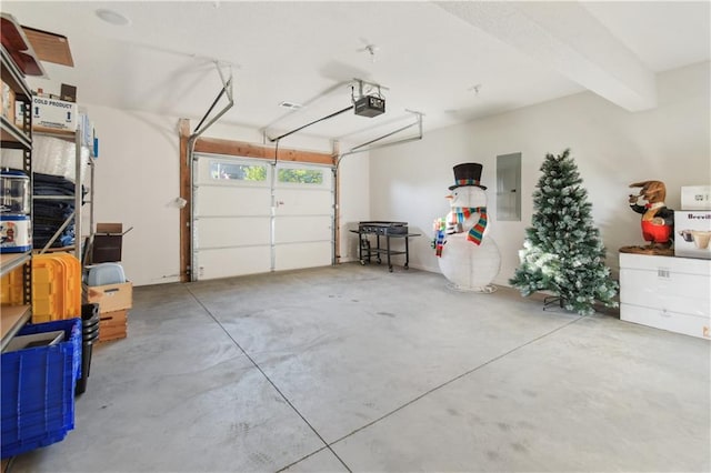 garage featuring a garage door opener and electric panel