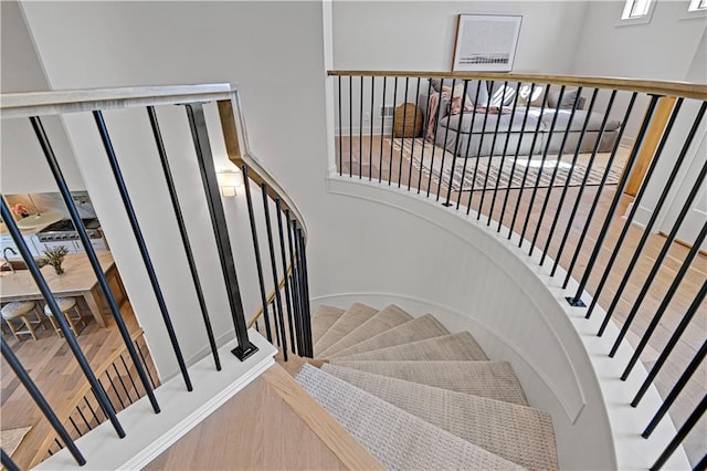 stairs with hardwood / wood-style floors