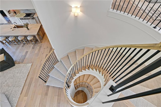 staircase featuring hardwood / wood-style flooring