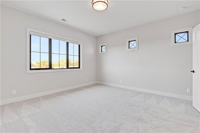 unfurnished room with carpet floors