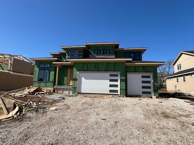 view of front of house featuring driveway and an attached garage